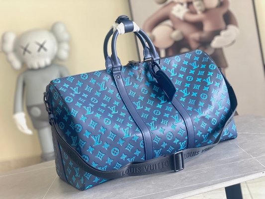 Sacs bleus de Keepall BANDOULIÈRE 50 Boston du sac des grands hommes marqués