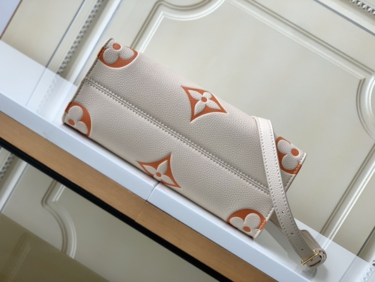 Monogramme géant OnTheGo millimètre Louis Vuitton Messenger Bag For Ipad Mini de safran crème