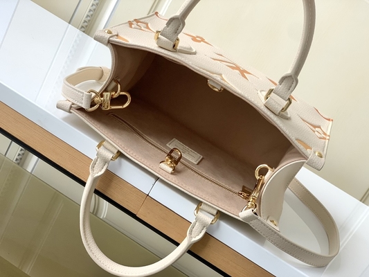 Monogramme géant OnTheGo millimètre Louis Vuitton Messenger Bag For Ipad Mini de safran crème
