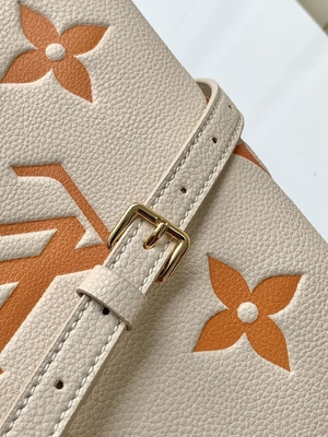 Monogramme géant OnTheGo millimètre Louis Vuitton Messenger Bag For Ipad Mini de safran crème