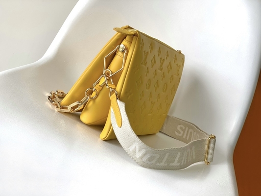Le monogramme de tournesol a gravé les sacs en refief marqués faits sur commande Coussin P.M. Louis Vuitton Puffy Lambskin