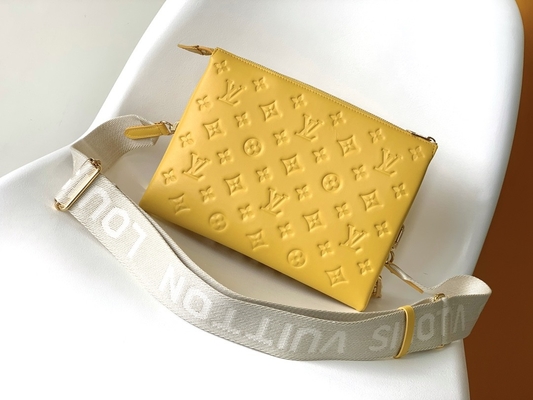 Le monogramme de tournesol a gravé les sacs en refief marqués faits sur commande Coussin P.M. Louis Vuitton Puffy Lambskin