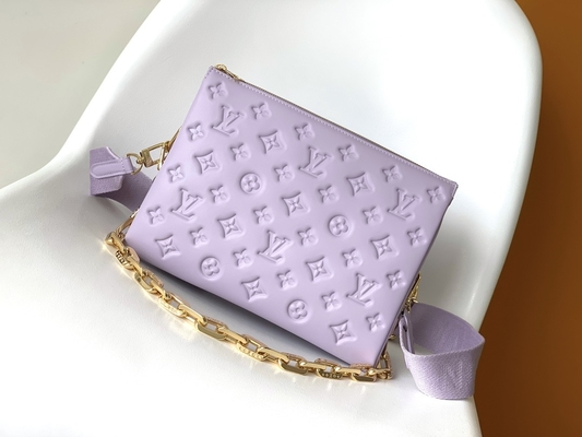 Le monogramme de tournesol a gravé les sacs en refief marqués faits sur commande Coussin P.M. Louis Vuitton Puffy Lambskin