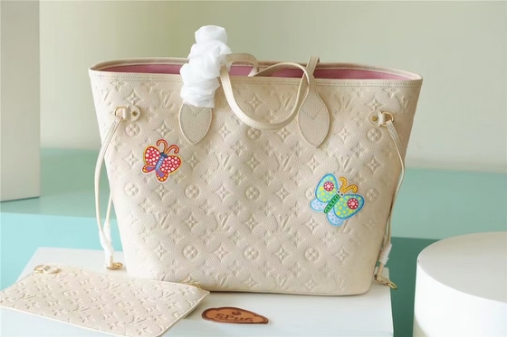 La partie a stigmatisé des dames monogramme Empreinte de Neverfull millimètre de sac à main avec la marqueterie de fleur