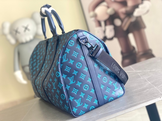 Sacs bleus de Keepall BANDOULIÈRE 50 Boston du sac des grands hommes marqués